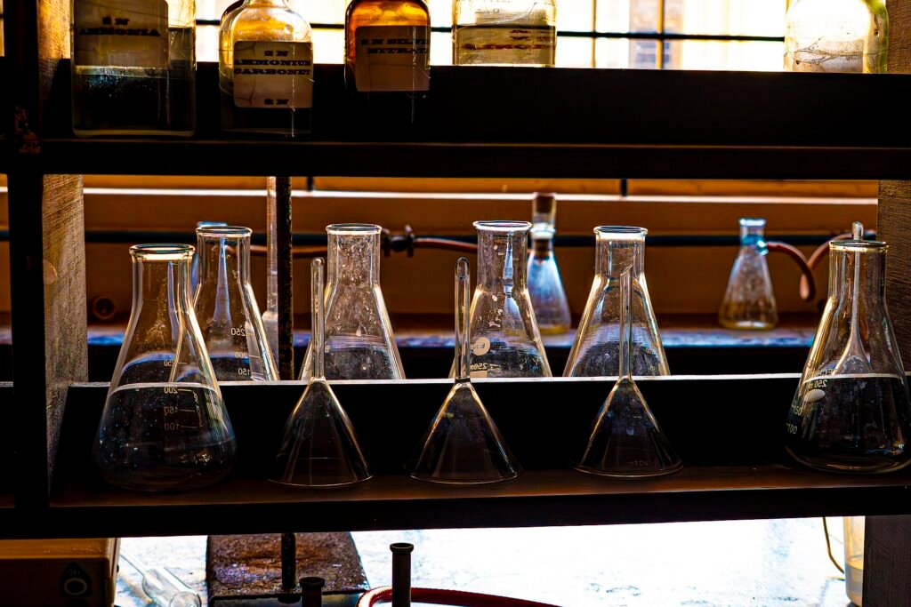 Conical laboratory flasks on a shelf