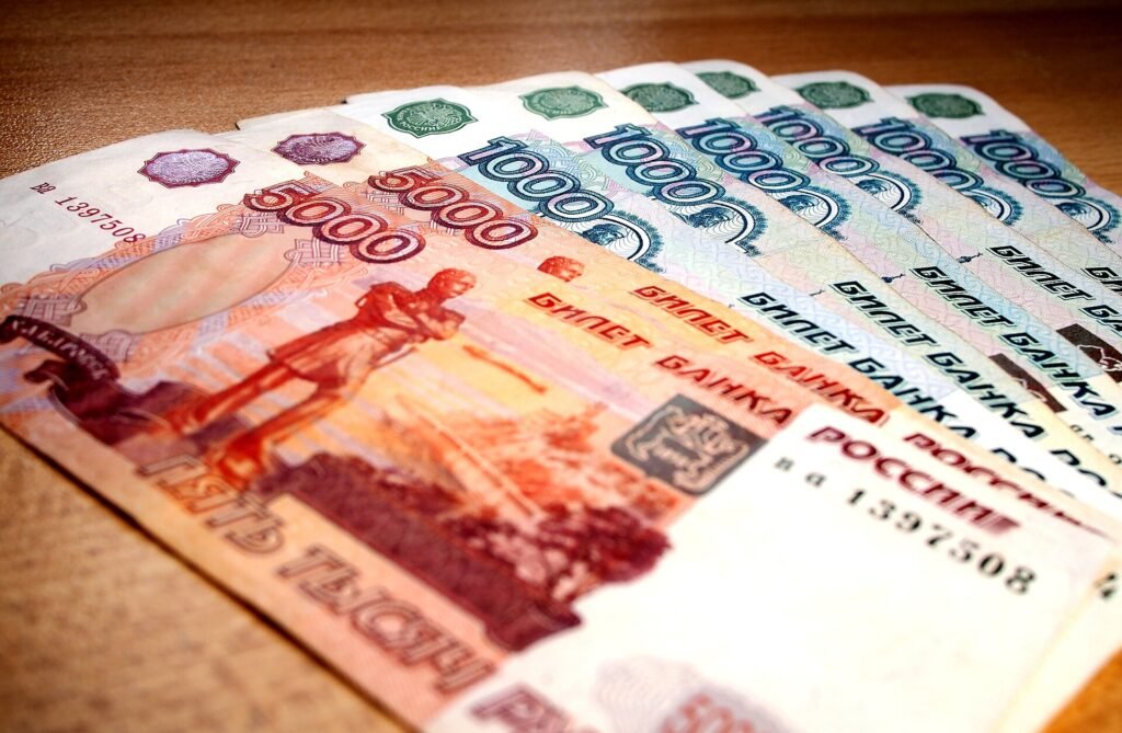 Russian ruble banknotes fanned out on a table