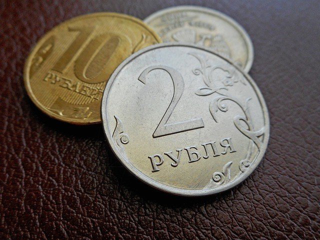 Russian ruble coins on a leather surface