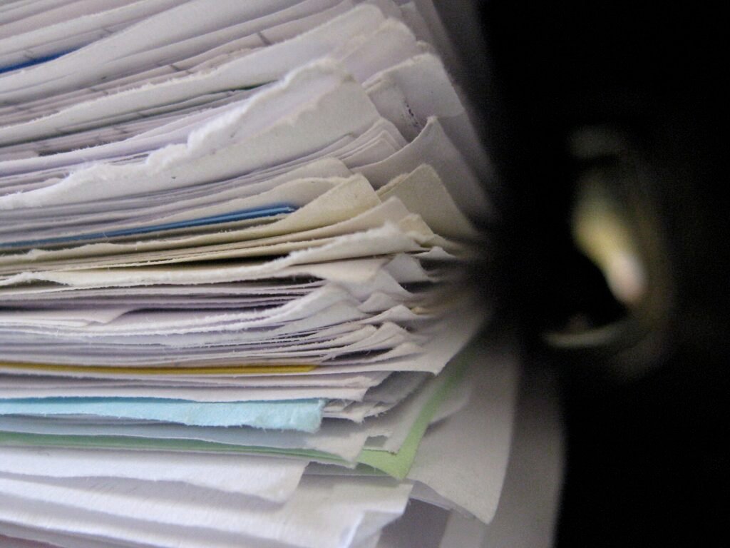 Stack of paper documents and folders